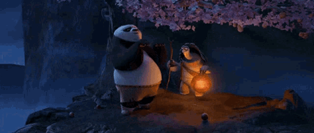 Animated panda holding a stick and a crab, standing near a monkey holding a lantern under pink cherry blossom tree at night.